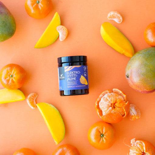 Electrolyte powder in mango-mandarin flavor by Organax Ltd, showing the vibrant orange and yellow powder in a clear container.
