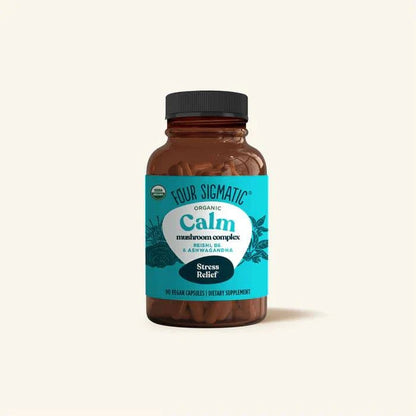 Organic mushroom supplement bottle with Reishi, B6, and Ashwagandha capsules by Organax Ltd, designed for wellness and relaxation.