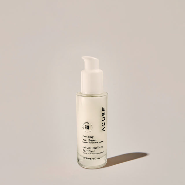 ACURE Revitabond Smooth Serum 50ml from Organax Ltd, a hair care treatment in a square bottle for strengthening and smoothing hair.