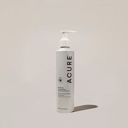ACURE Revitabond Restoration Conditioner in 250ml bottle, strengthening hair bond repair conditioner from Organax Ltd.