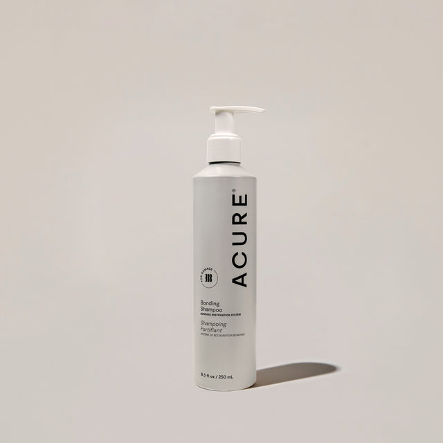 ACURE Revitabond Restoration Shampoo by Organax Ltd, 250ml, strengthening bond repair hair care shampoo showing the bottle.