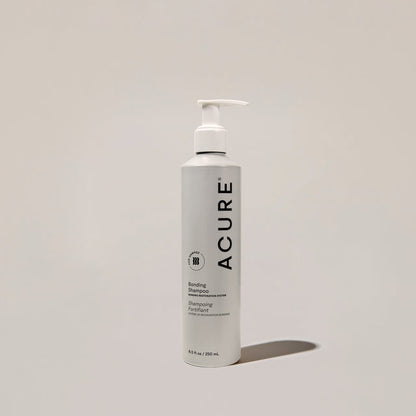 ACURE Revitabond Restoration Shampoo by Organax Ltd, 250ml, strengthening bond repair hair care shampoo showing the bottle.