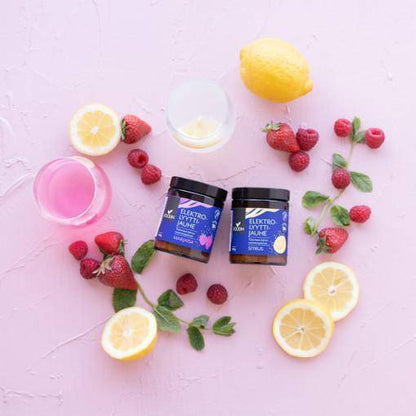 Electrolyte powder in citrus flavor by Organax Ltd, showing a 120g container with orange and lemon illustrations on the label.