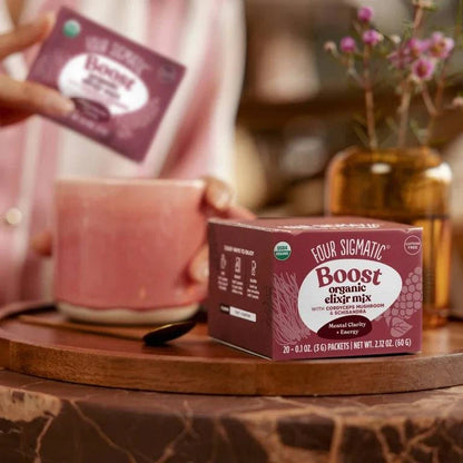Organic Boost Elixir sachets with Cordyceps by Organax Ltd, showing a row of 20 sachets in a natural setting.