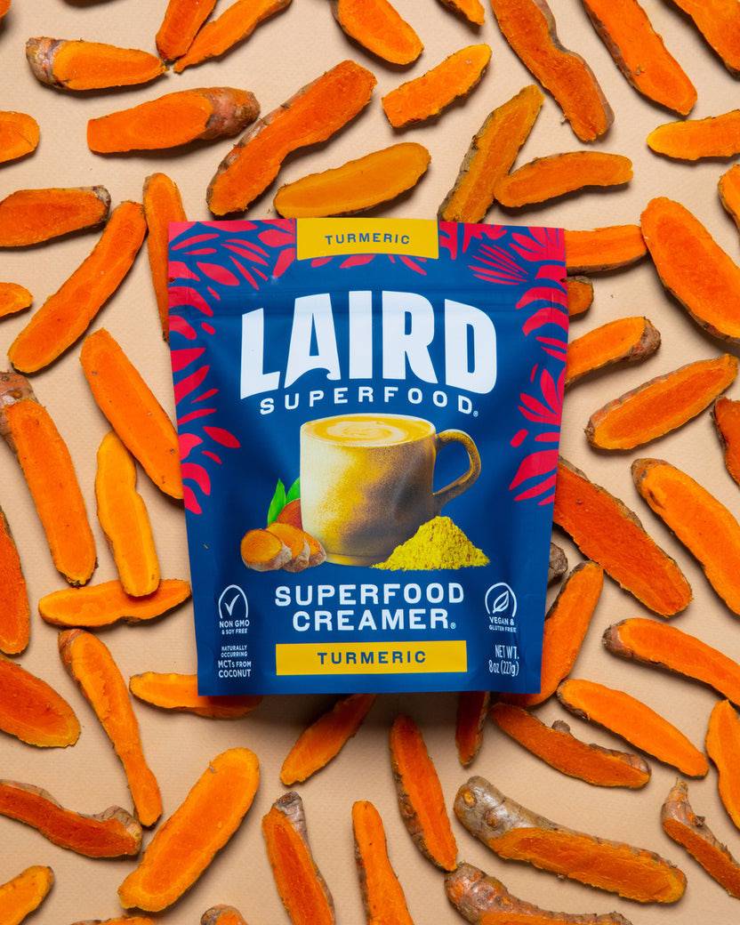Laird Turmeric Superfood Creamer by Organax Ltd in a 227g container, showing the product label with turmeric-themed design