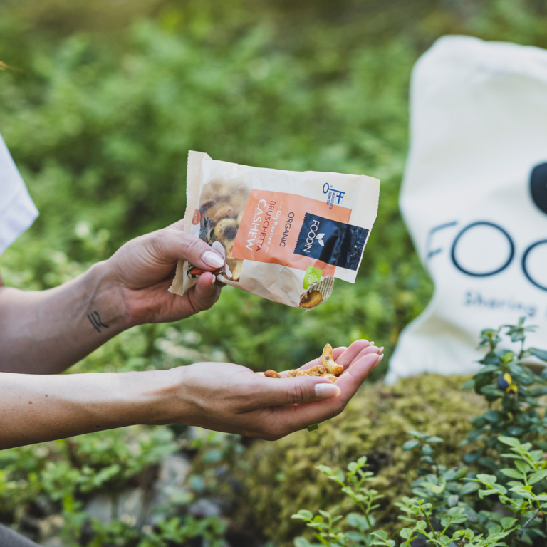 Organic FoodIn dry roasted bruschetta cashews in a 120g package, showing golden roasted cashews with a crispy texture.