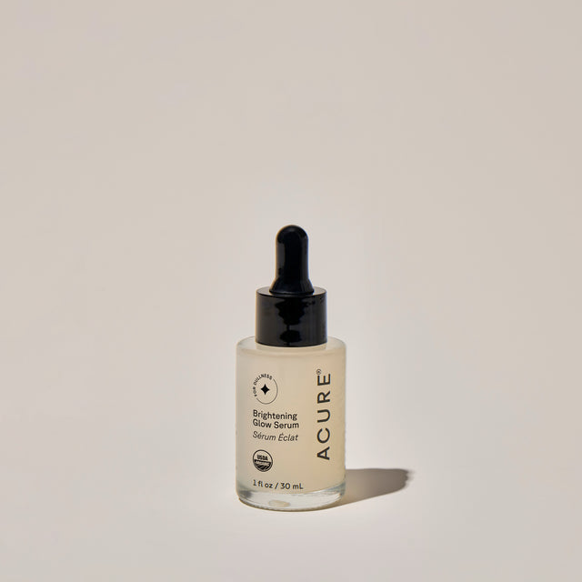 Brightening glow serum in a 30ml square-shaped bottle from ACURE, part of Organax Ltd skincare collection.