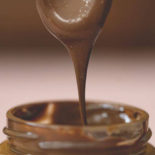 Organic Herkkuisa Nutella hazelnut cacao spread jar from Organax Ltd, showing a 250g glass container with nutty spread inside.