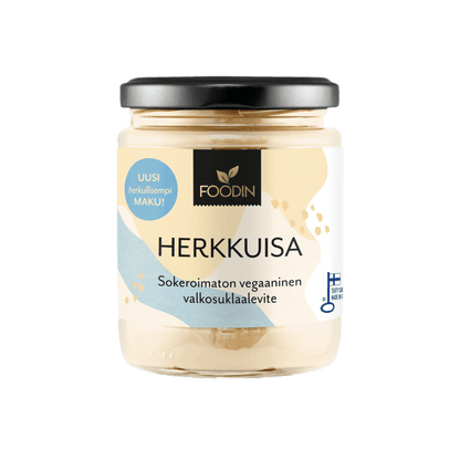 White chocolate spread in a jar labeled Herkkuisa by Organax Ltd, featuring a white and brown packaging design.