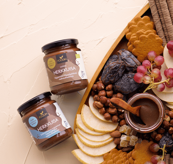 Organic Herkkuisa Nutella-style hazelnut cacao spread jar from Organax Ltd, showcasing the dark, creamy spread.