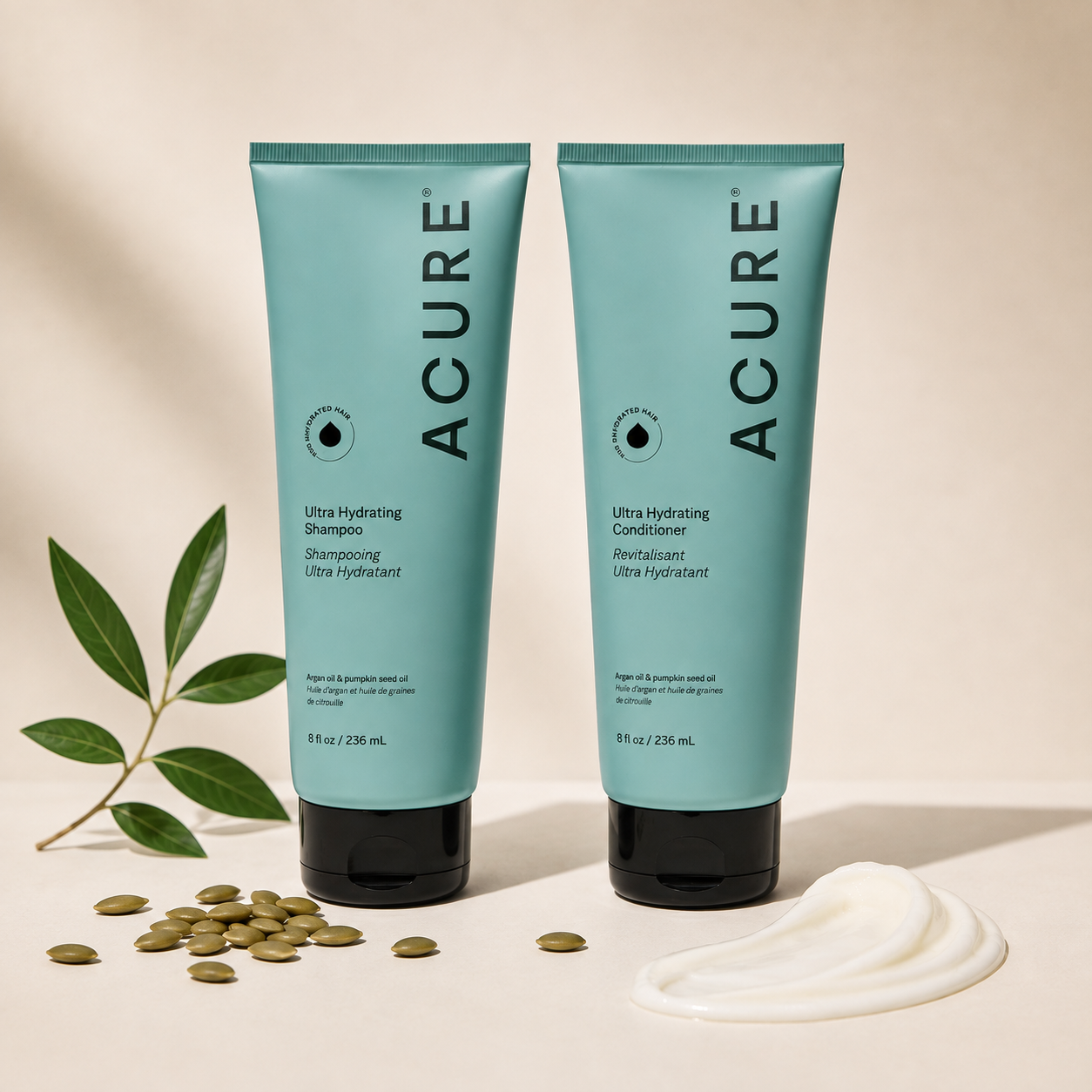 ACURE Ultra Hydrating Shampoo and Conditioner bundle by Organax Ltd, featuring bottles with blue and white labels on a bathroom shelf.