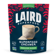 Laird Reduced Sugar Superfood Creamer by Organax Ltd in a 227g container, showing the creamy, nutritious powder inside.