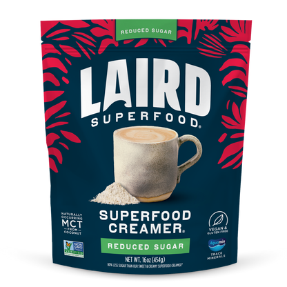 Laird Reduced Sugar Superfood Creamer by Organax Ltd in a 227g container, showing the creamy, nutritious powder inside.