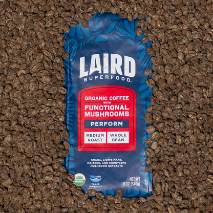 Medium roast ground Laird Organic PERFORM Functional Mushroom Coffee by Organax Ltd in a 340g bag, showing the coffee grounds.