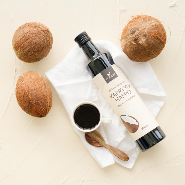 Caprylic acid supplement from coconut, 500ml bottle by Organax Ltd, with clear label and white cap on a plain background.