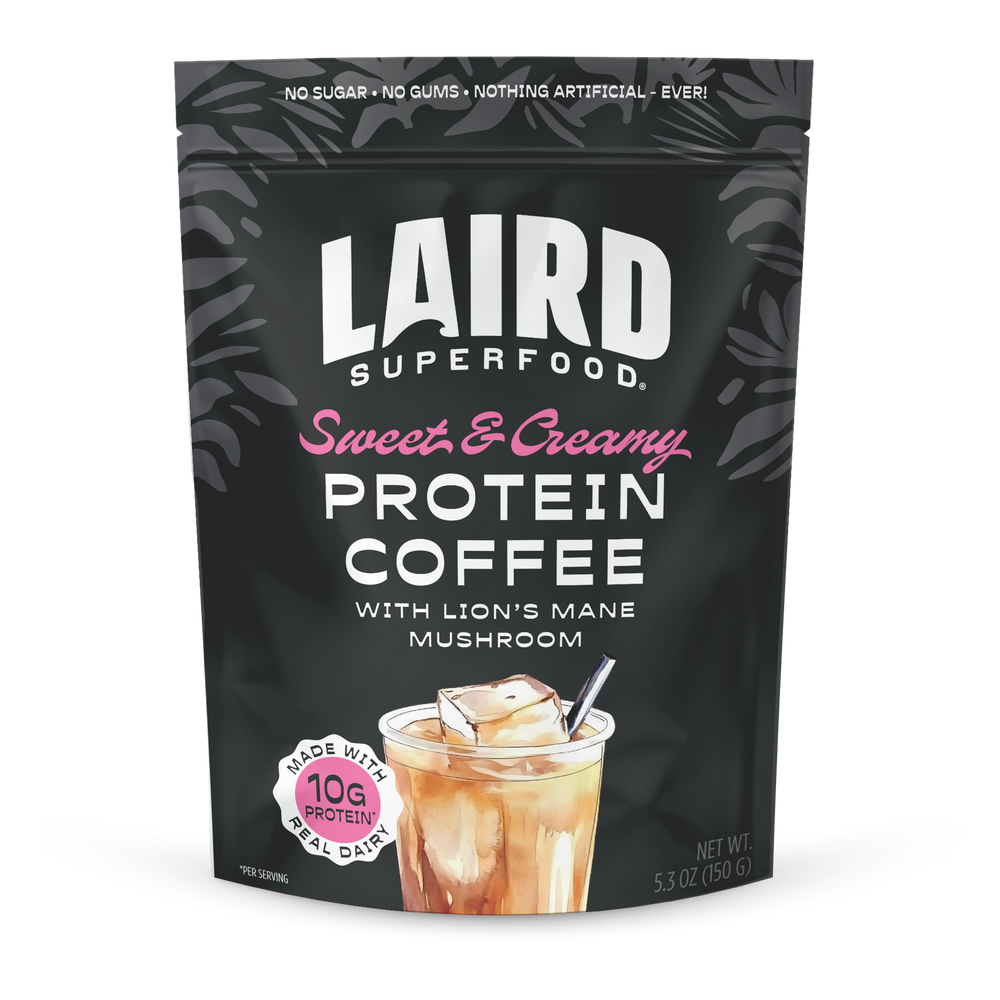 Laird Sweet & Creamy Protein Coffee with Lion's Mane by Organax Ltd, 150g, showing a creamy coffee beverage with coffee beans.