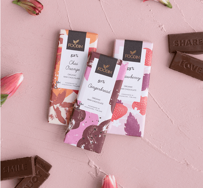 Organic raw chocolate with hazelnuts, Foodin Crunchu 54%, in a 40g bar from Organax Ltd, showing the chocolate and hazelnuts.
