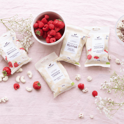 Organic white chocolate with strawberry flavor from FoodIn by Organax Ltd, shown in a 50g package.