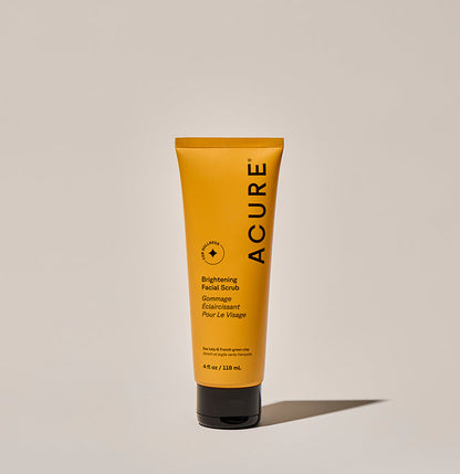 Brightening facial scrub in a 118ml bottle by Organax Ltd, featuring natural ingredients and a gentle exfoliating texture.