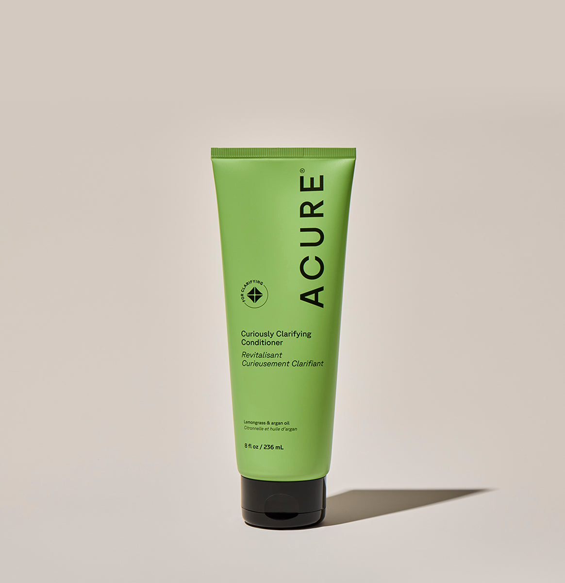 ACURE Curiously Clarifying Shampoo and Conditioner bundle by Organax Ltd, featuring bottles with clear liquid and label details.
