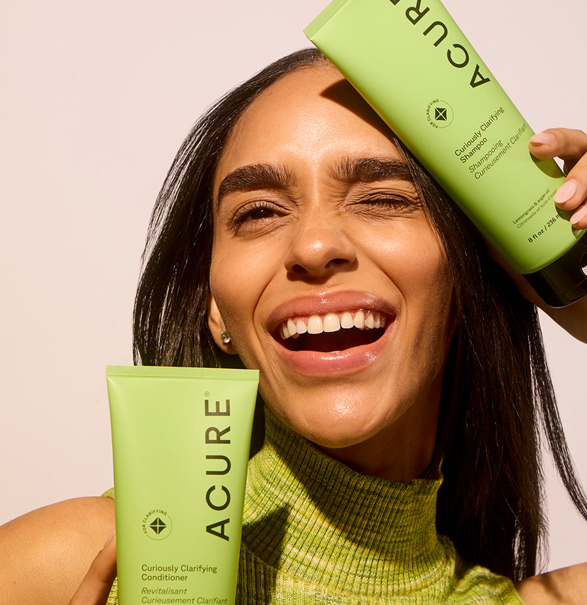 ACURE Curiously Clarifying Shampoo and Conditioner bundle by Organax Ltd, featuring bottles of hair cleansing and conditioning products.