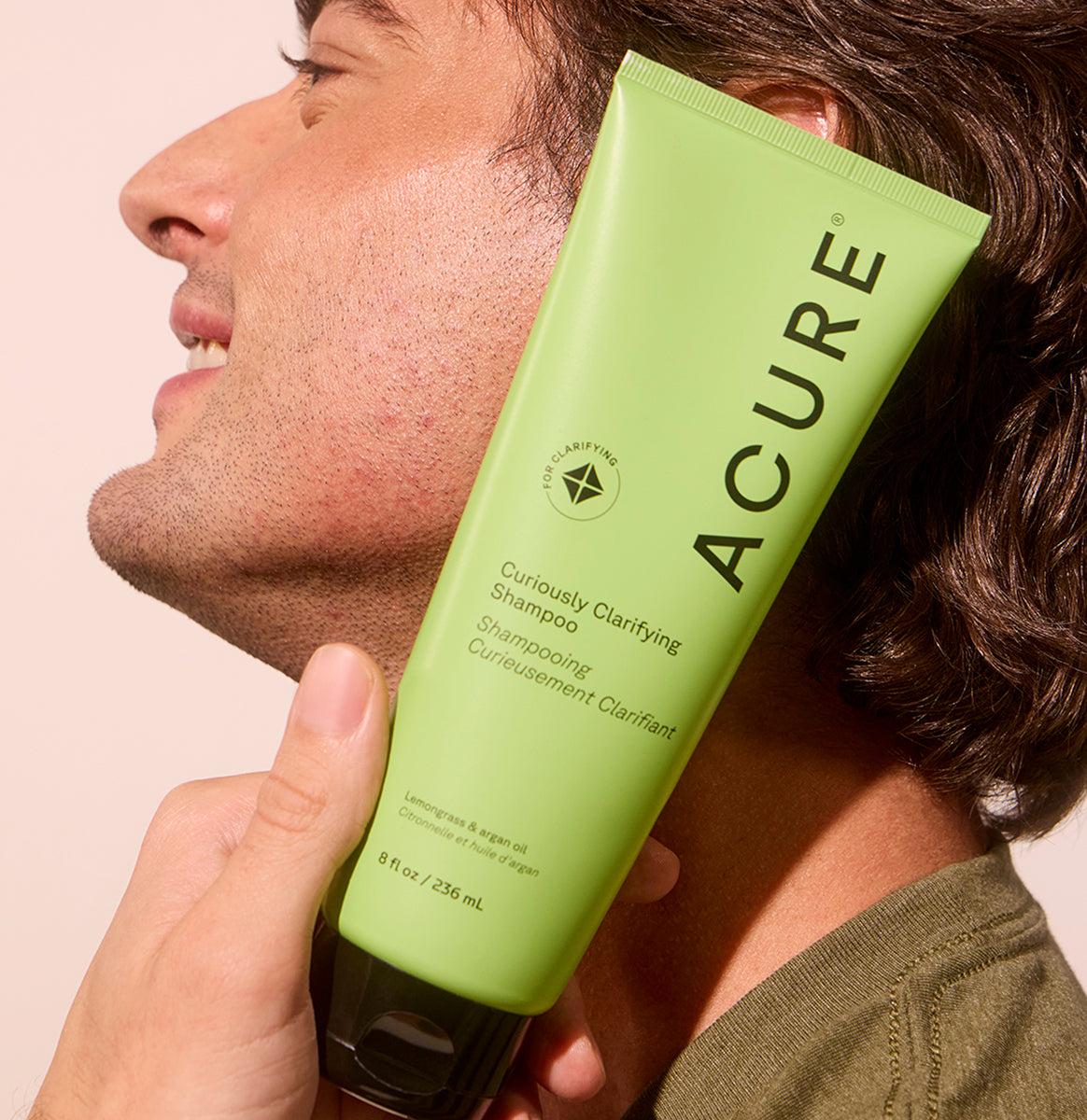 ACURE Curiously Clarifying Shampoo and Conditioner bundle from Organax Ltd, featuring bottles of shampoo and conditioner with labels.