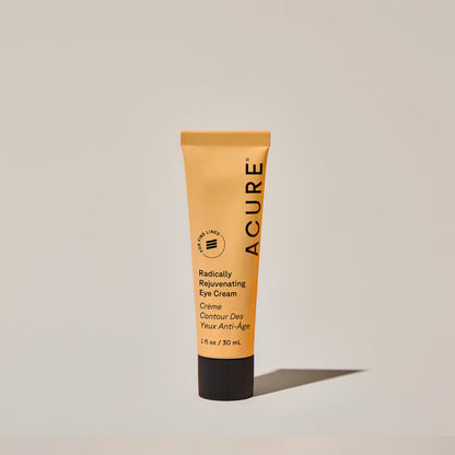 Tube of ACURE Radically Rejuvenating Eye Cream by Organax Ltd, showing the product in a sleek square packaging.