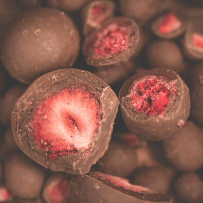 Organic raw chocolate with strawberry from Organax Ltd, showing a 50g package of FoodIn Strawberry Raw Chocolate.