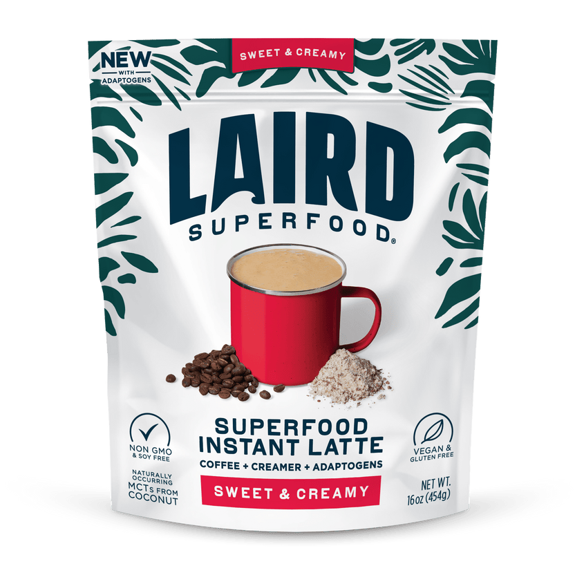 Laird Sweet & Creamy Instant Latte with Adaptogens in 227g jar, showing the latte powder with a spoon and packaging.