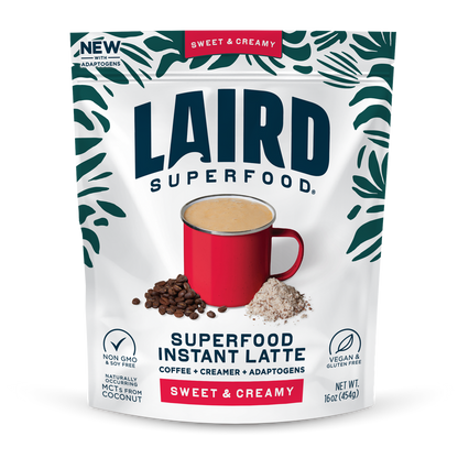 Laird Sweet & Creamy Instant Latte with Adaptogens in 227g container, featuring a steaming cup of latte with a creamy froth and latte mix bag