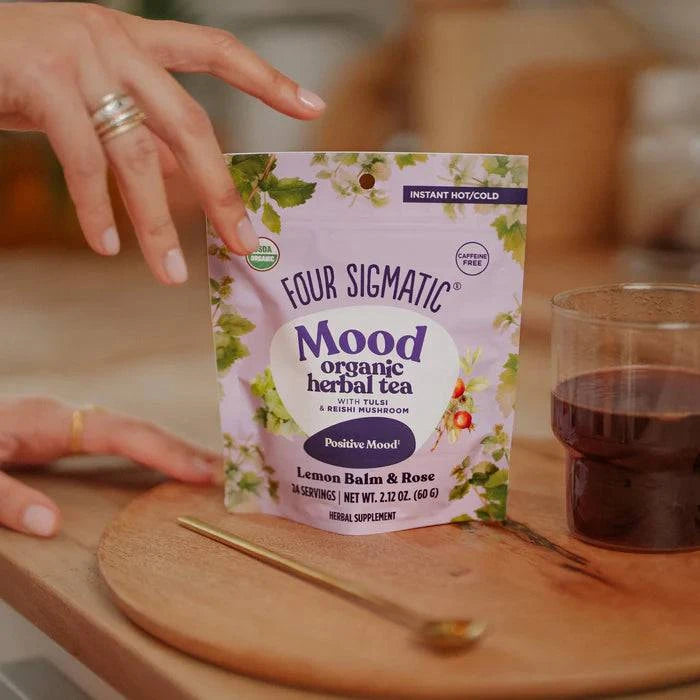 Organic Four Sigmatic Mood Herbal Tea in a 60g package, featuring dried herbal ingredients in a square-shaped container.