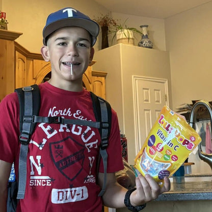Vitamin C sugar-free Zollipops lollipops by Organax Ltd, showcasing colorful fruit-flavored candies in a 227g package.