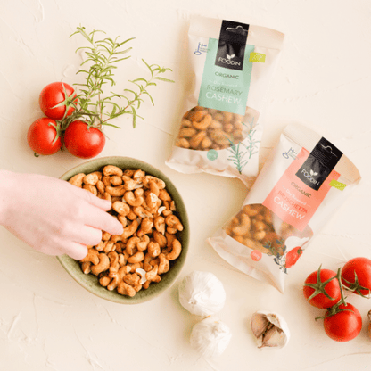 Organic FoodIn Dry Roasted Bruschetta Cashew nuts in 120g packaging, showcasing golden roasted cashews with a bruschetta seasoning appearance.