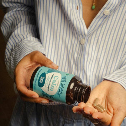 Organic Mushroom Capsules with Reishi, B6, and Ashwagandha by Organax Ltd, showing the calm supplement capsules in a clear container.