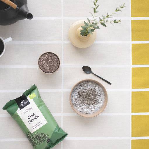 Organic Chia Seeds in a 600g package by Organax Ltd, shown in a close-up image with chia seeds spread out.