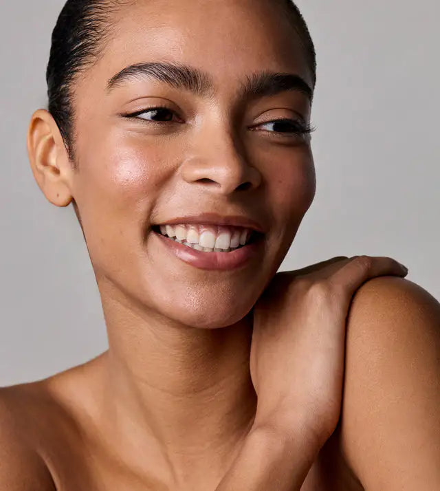 Clean surface of the ACURE Skin Longevity Night Trio skincare products on a white background.