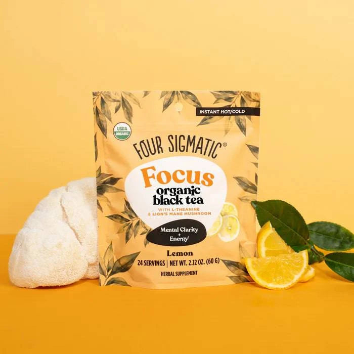 Four Sigmatic Organic Focus Black Tea in a 60g package, featuring a steaming cup of black tea with fresh tea leaves on top.