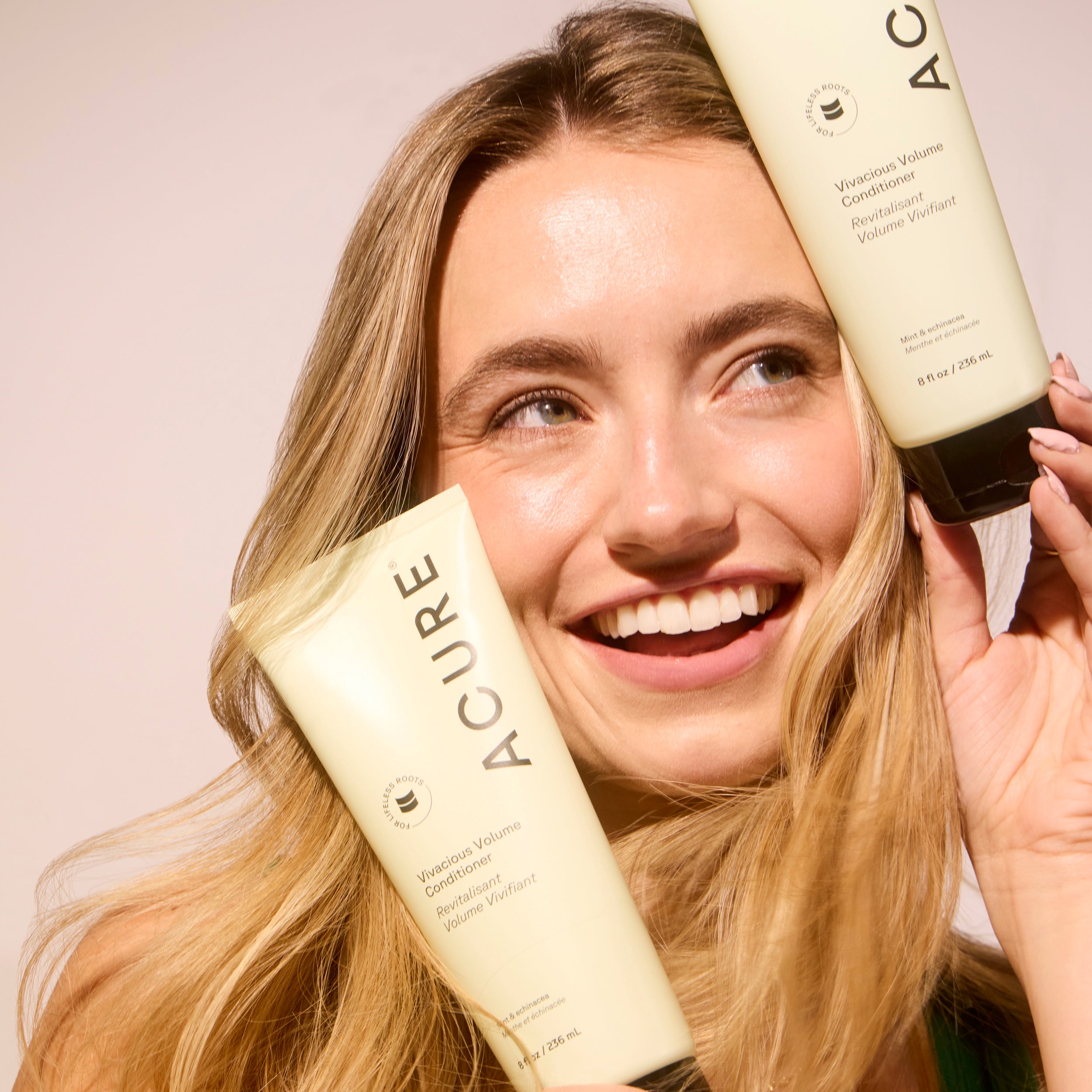 ACURE Vivacious Volume Shampoo and Conditioner bundle by Organax Ltd, with vibrant packaging and healthy, voluminous hair.