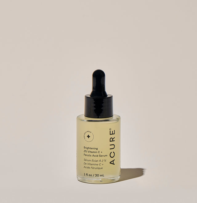 Brightening ACURE Vitamin C and Ferulic Acid serum in a 30ml bottle, featuring clear liquid and dropper applicator.