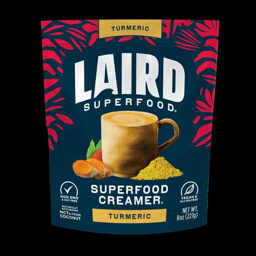 Laird Turmeric Superfood Creamer by Organax Ltd in 227g jar, featuring vibrant turmeric powder with a spoon and fresh turmeric roots.