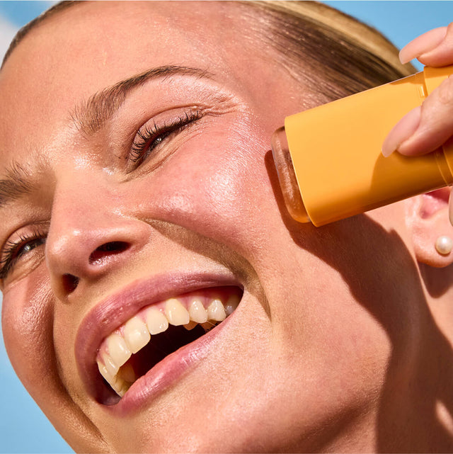 Invisible sunscreen stick SPF 50 by Organax Ltd, showing ingredients and smooth application surface.